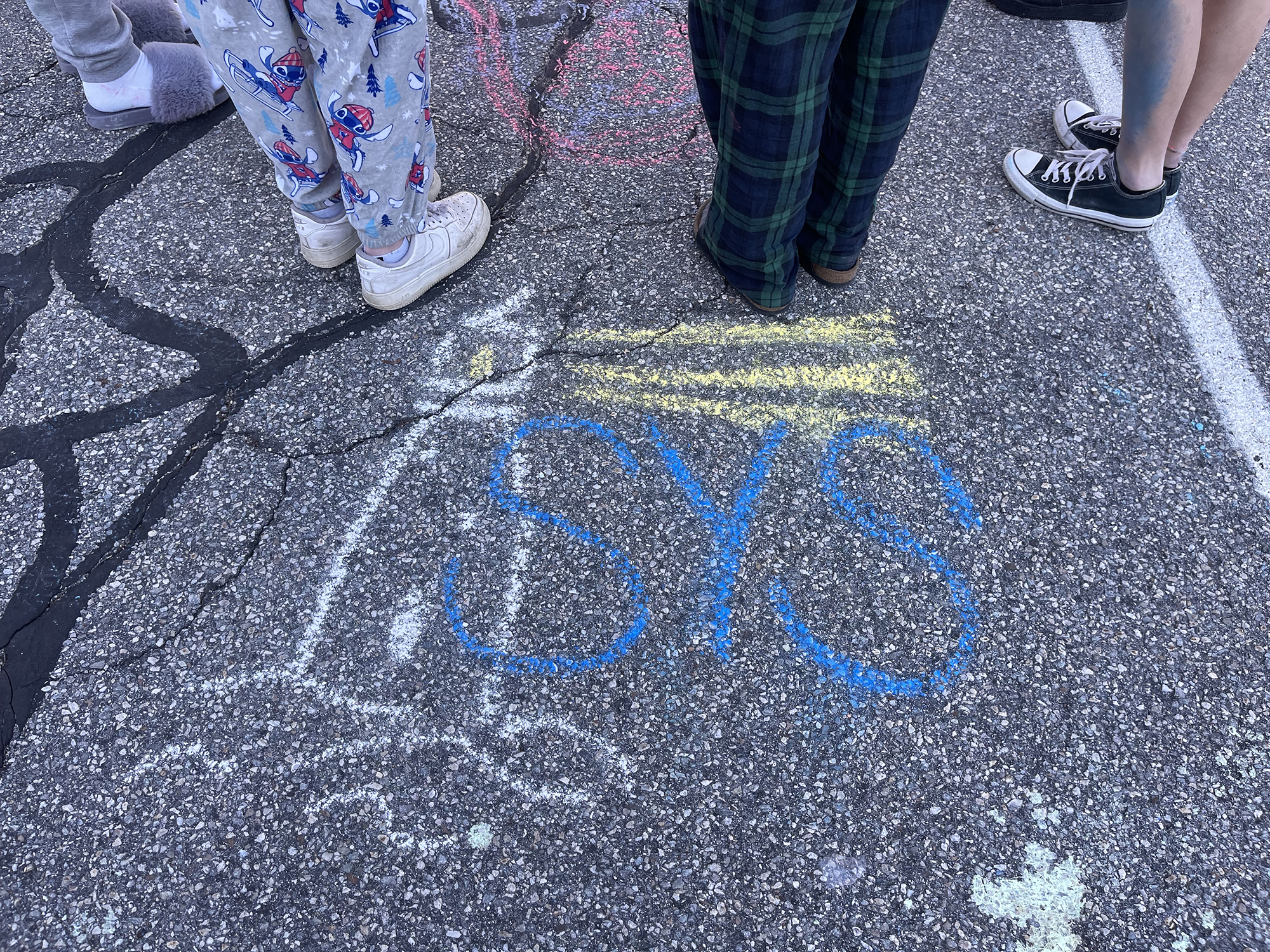 SYS written in chalk on sidewalk